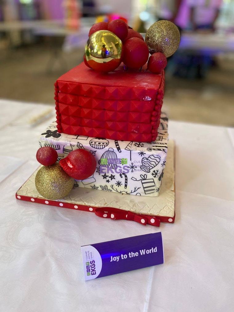Two-tier Christmas cake with red quilted fondant and gold baubles