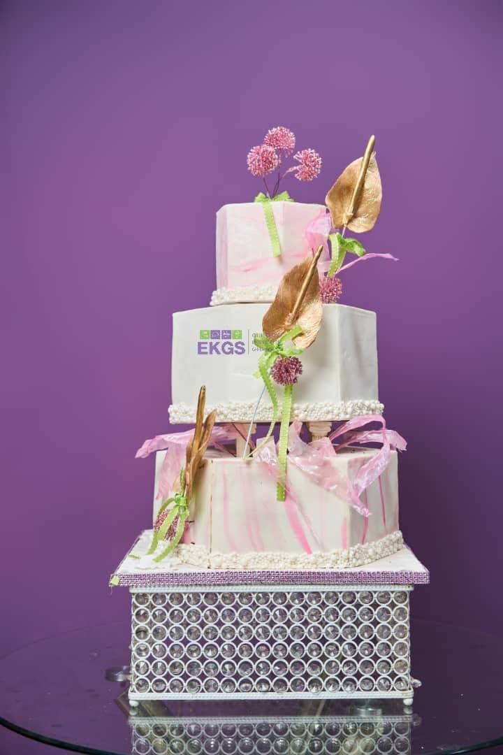 Square pink-marbled tiers with gold sugar anthuriums