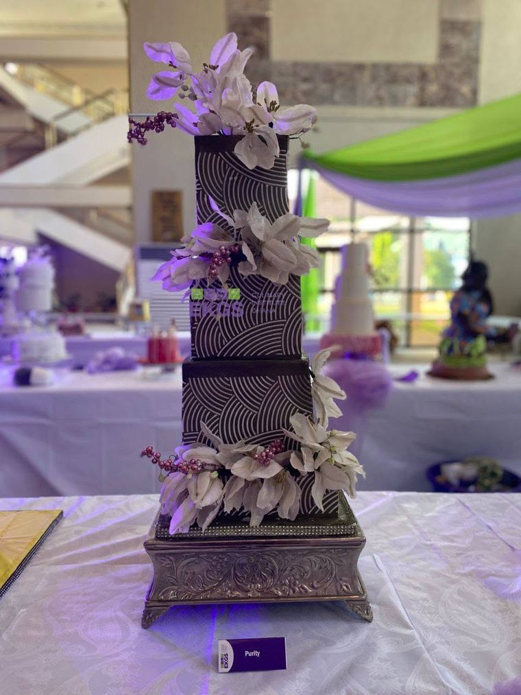 Square chocolate-patterned tiers with white sugar flowers