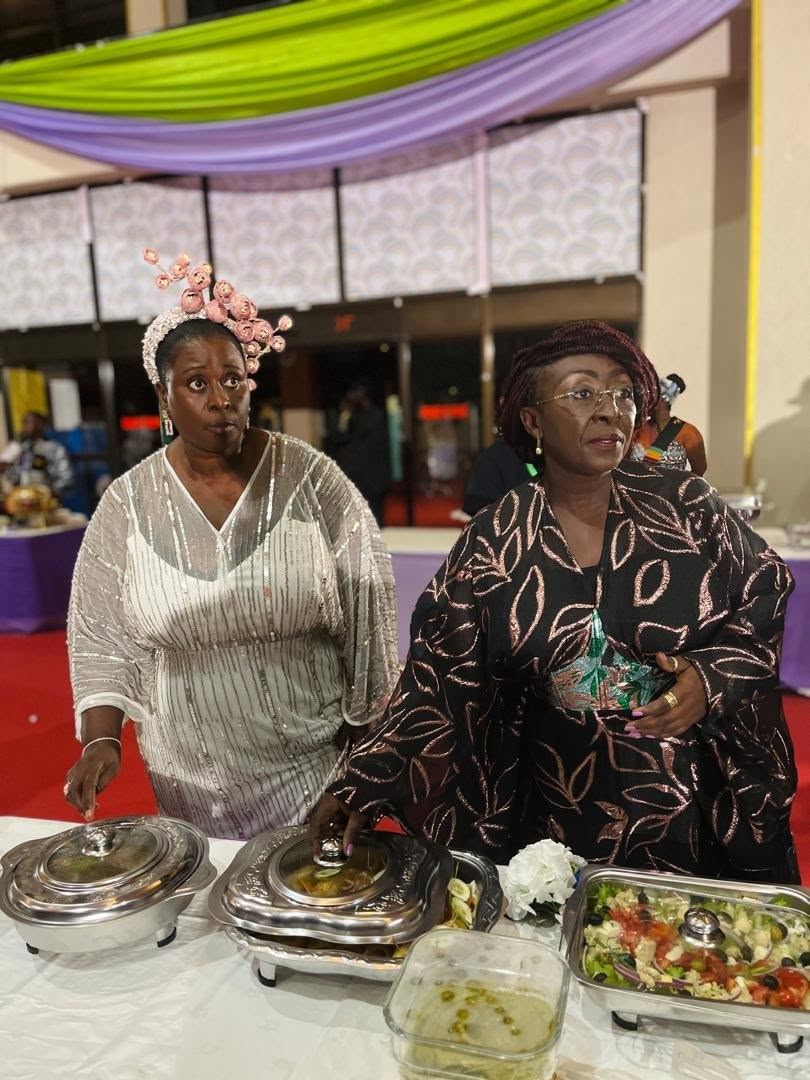 EKGS leadership at the buffet table during a graduation exhibition